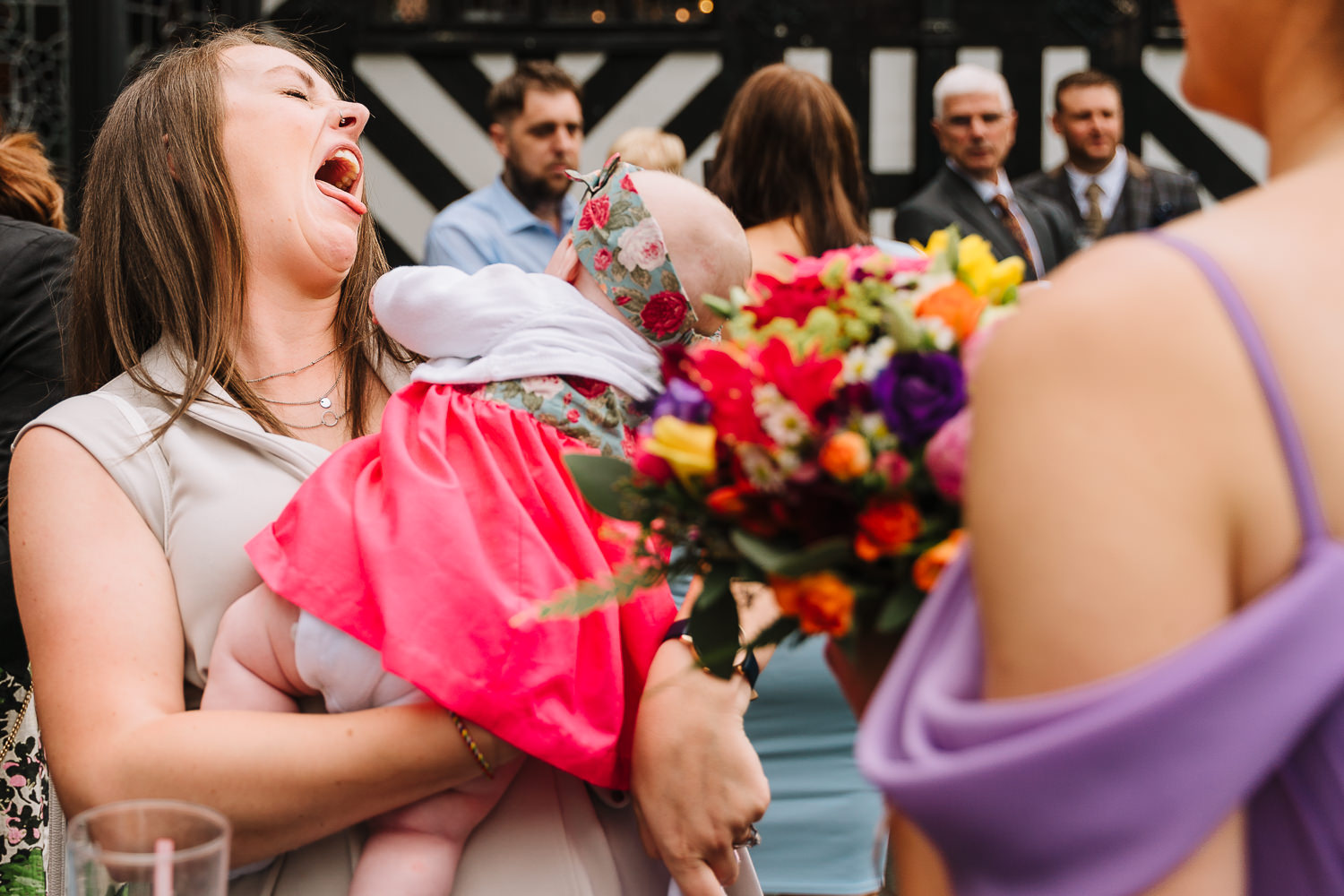 Samlesbury Hall Wedding Photography 12 Wedding guest and baby laughing