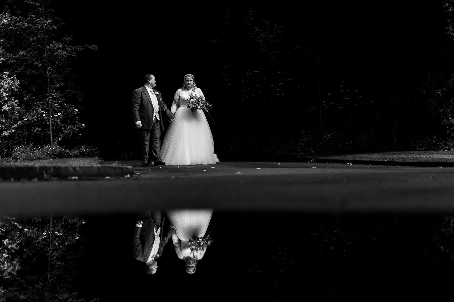 Samlesbury Hall Wedding Photography 15 bride and groom walking at Samlesbury Hall