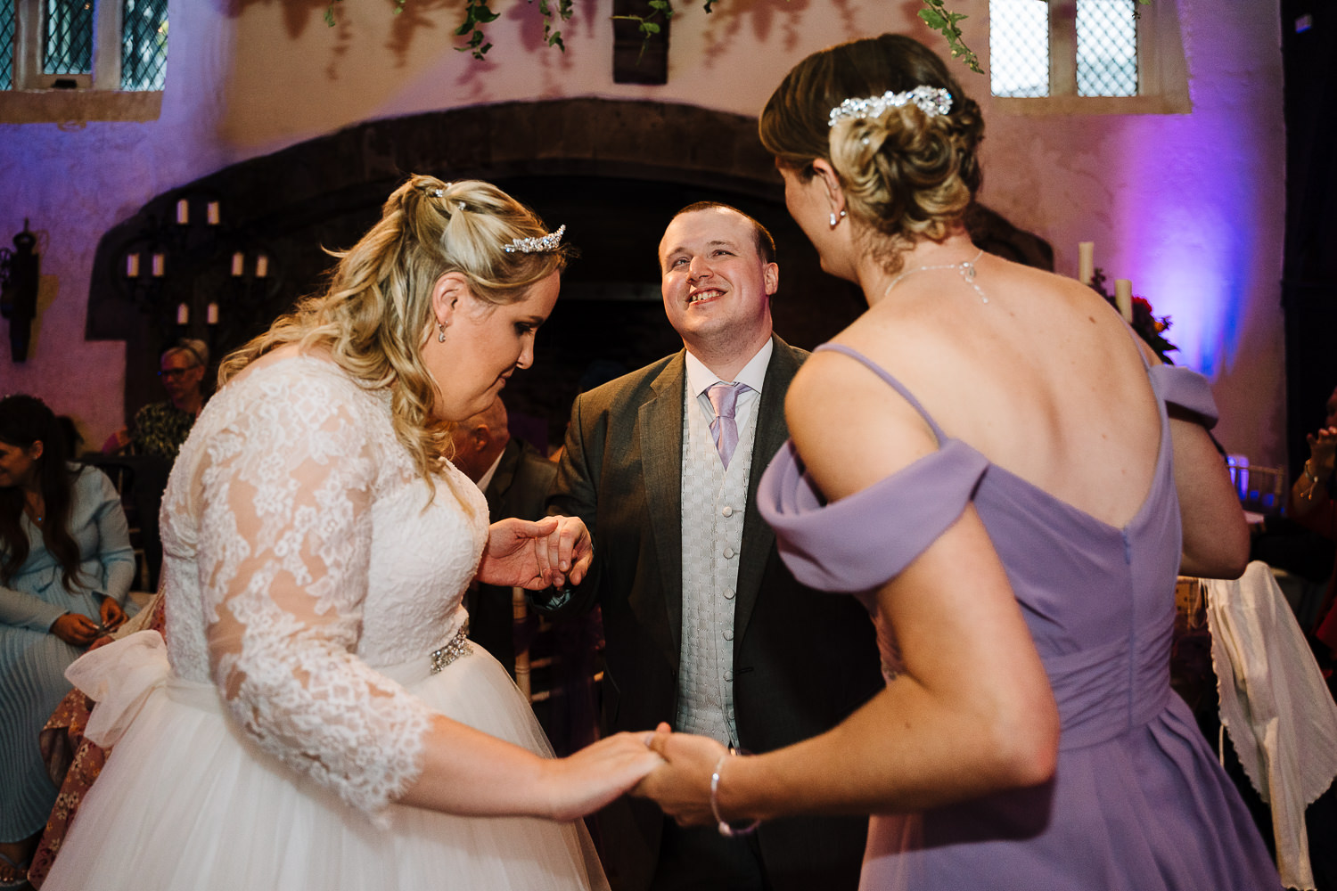 Samlesbury Hall Wedding Photography 32 Bride and groom dancing with bridesmaid