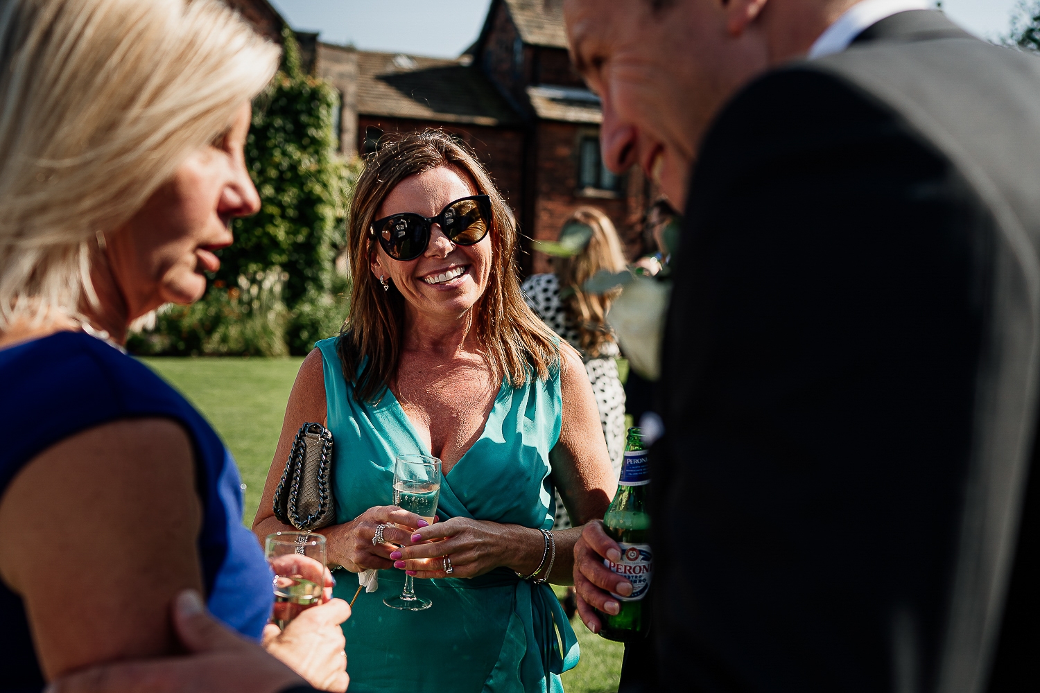 Colshaw Hall Wedding Photos 26 Guests laughing at Colshaw Hall