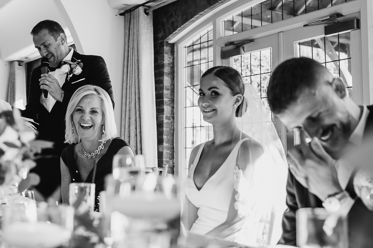 Colshaw Hall Wedding Photos 41 top table laughing