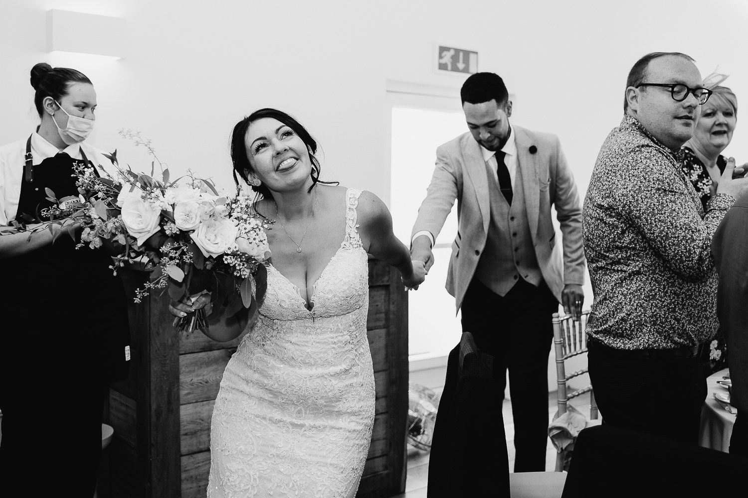 Iscoyd Park Wedding 42 Bride and groom walking into wedding breakfast
