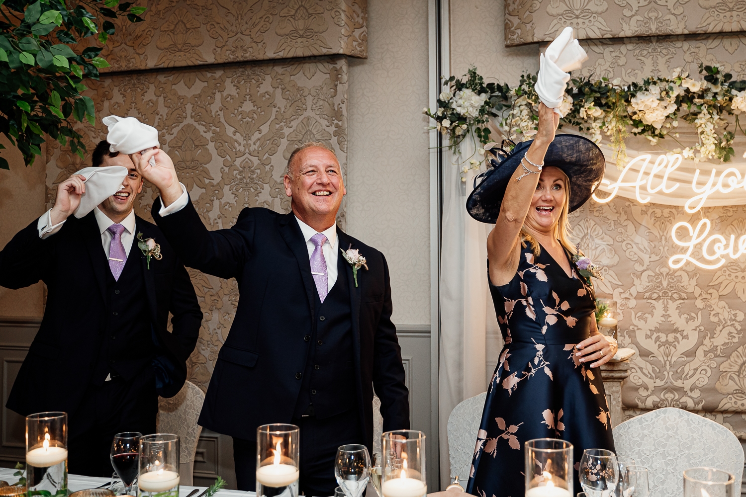 Parents welcoming in the bride and groom