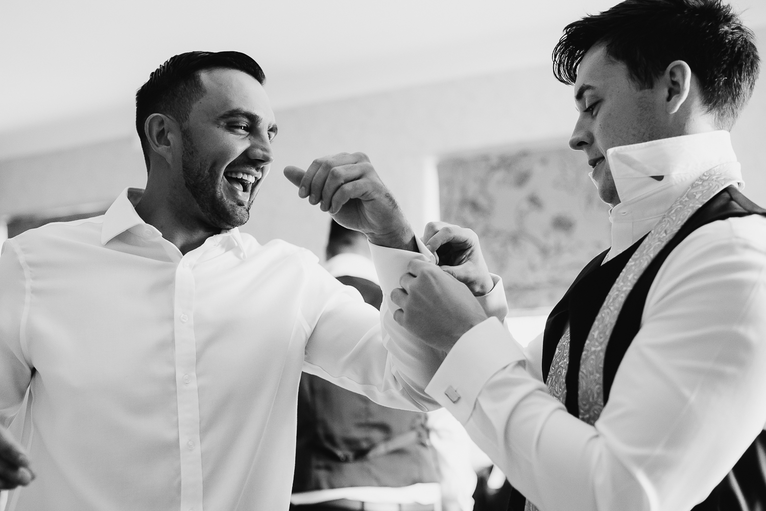 Groom getting dressed