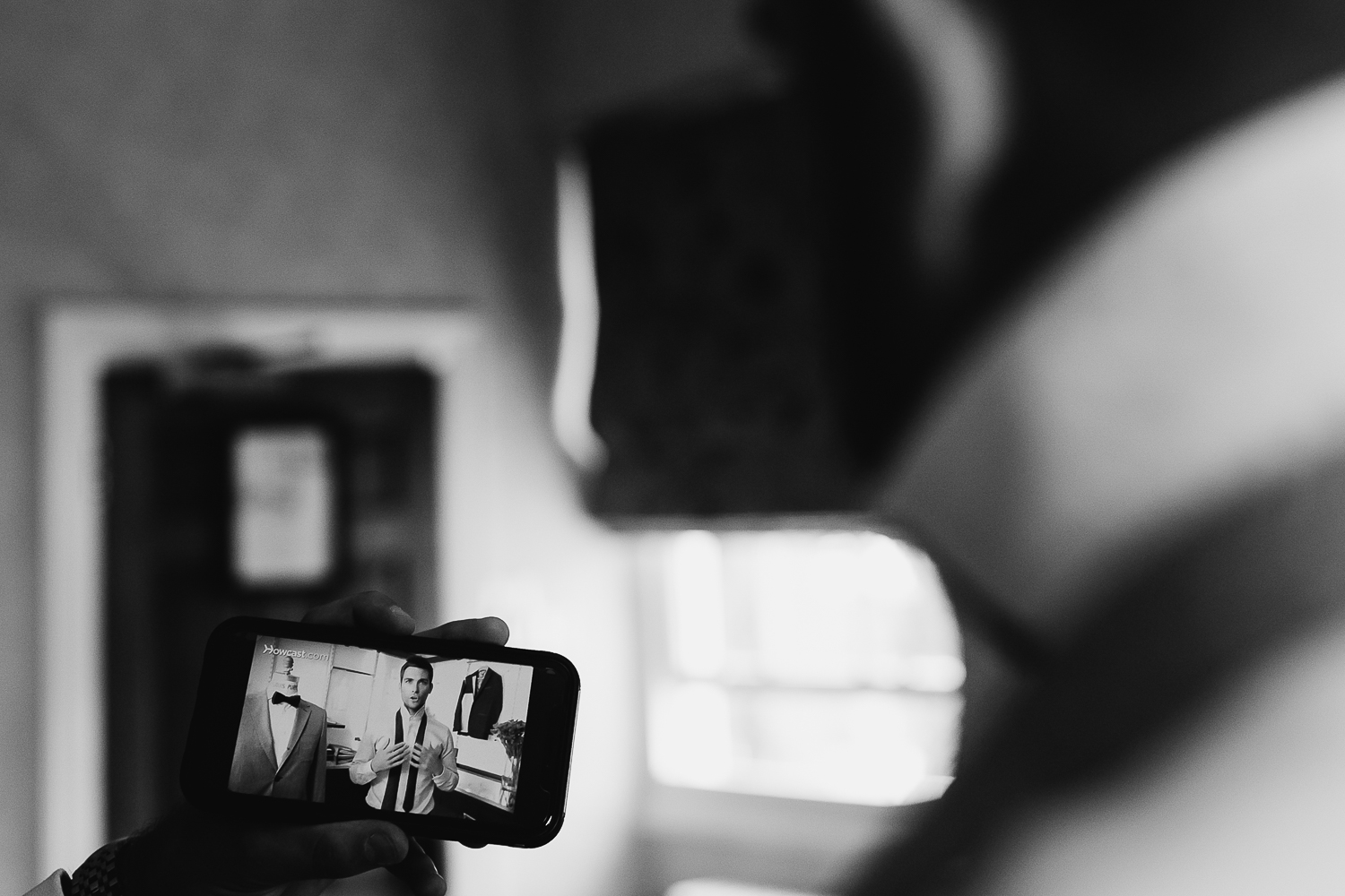 Groom watching a video
