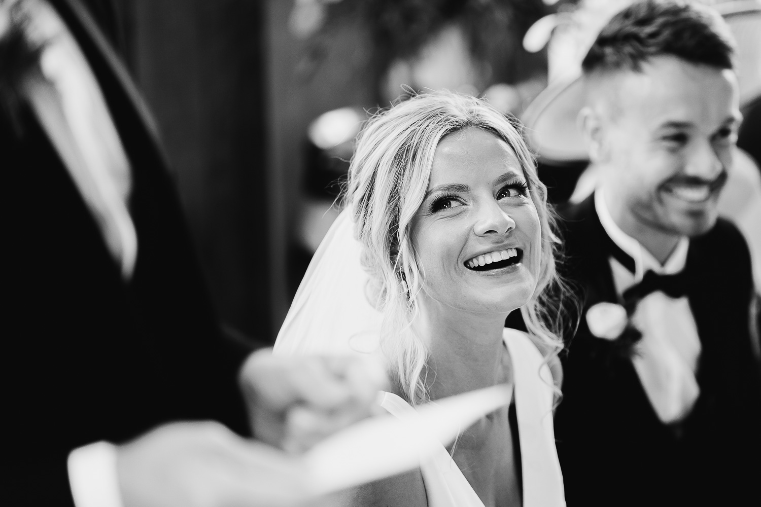 Bride smiling at her dad during speeches