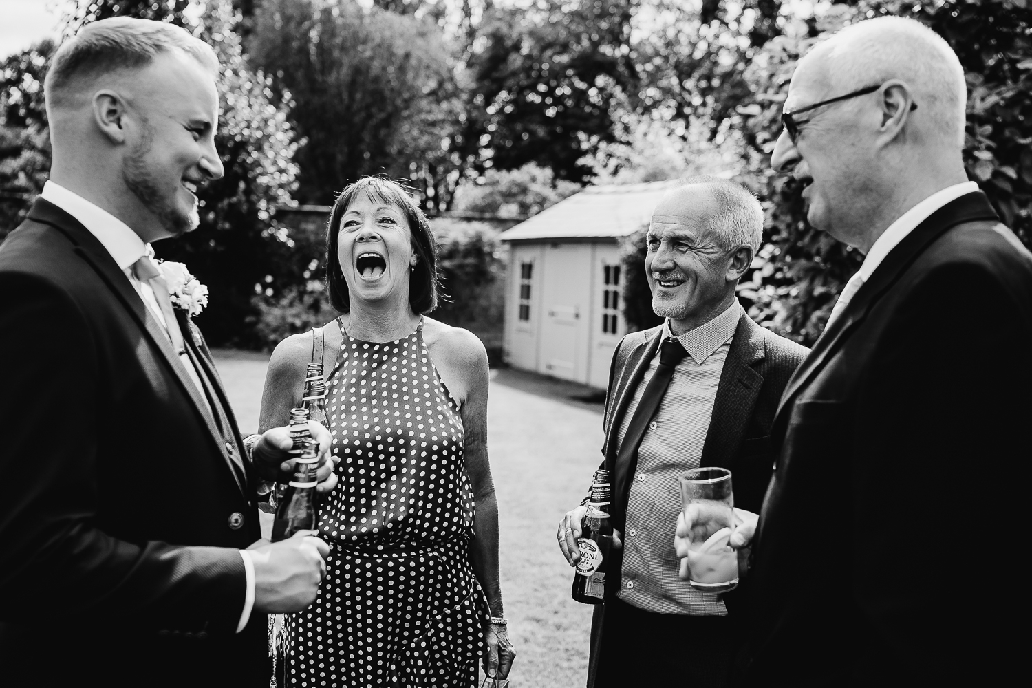 Wedding guests laughing during drinks at Colshaw Hall