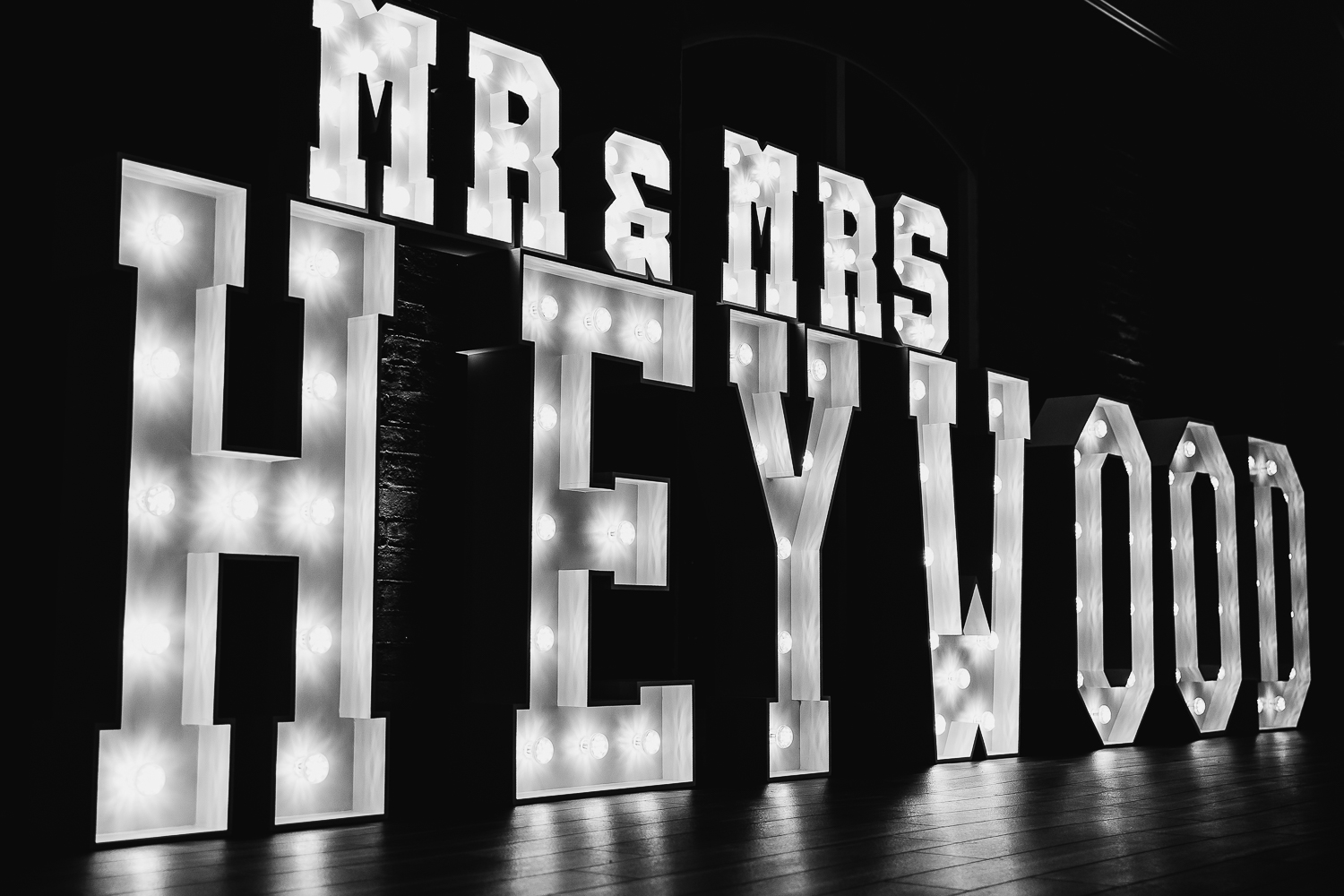 Photo of couples name lit up in love letters