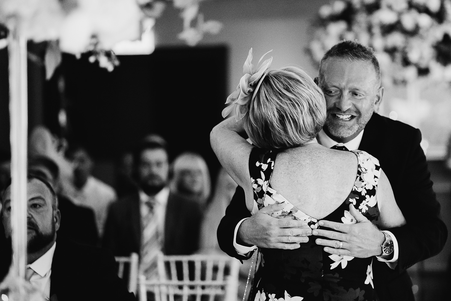Mother of the groom hugging a guest