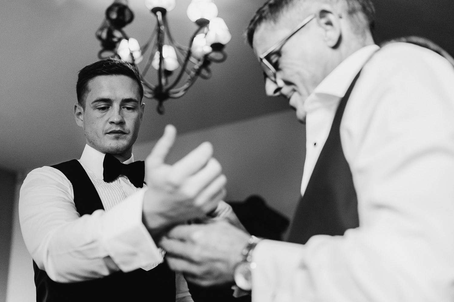 Best man helping the groom