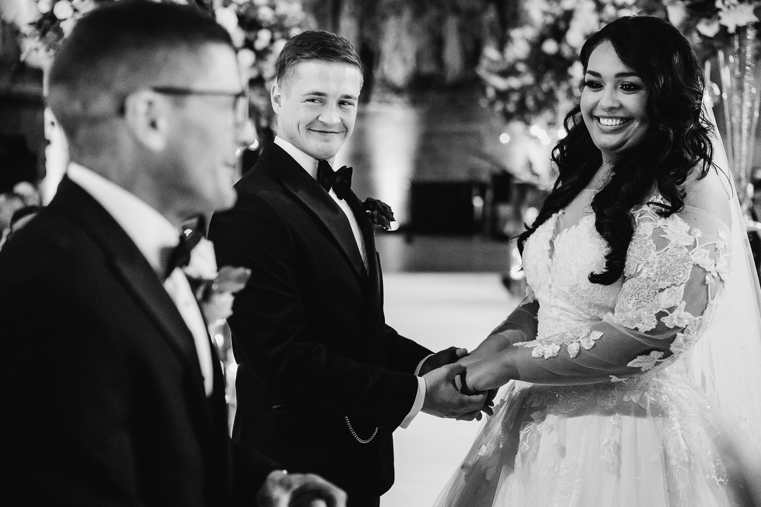 bride and groom laughing with best man