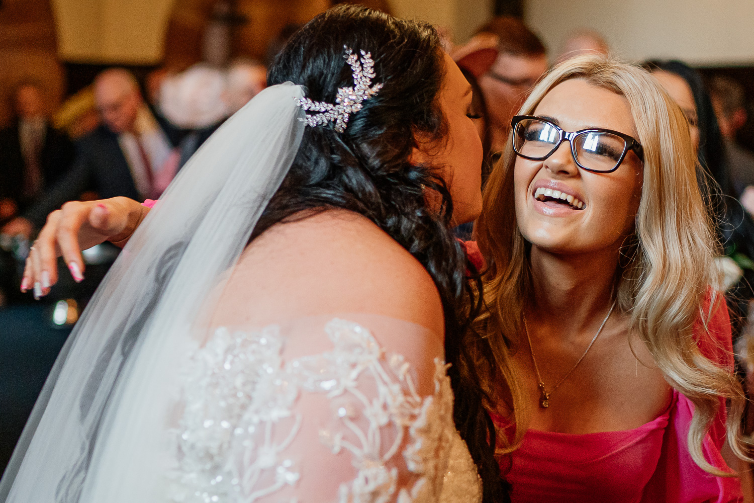 Bride hugging a guest