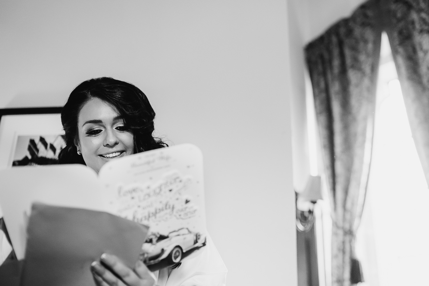 Bride reading her card from groom