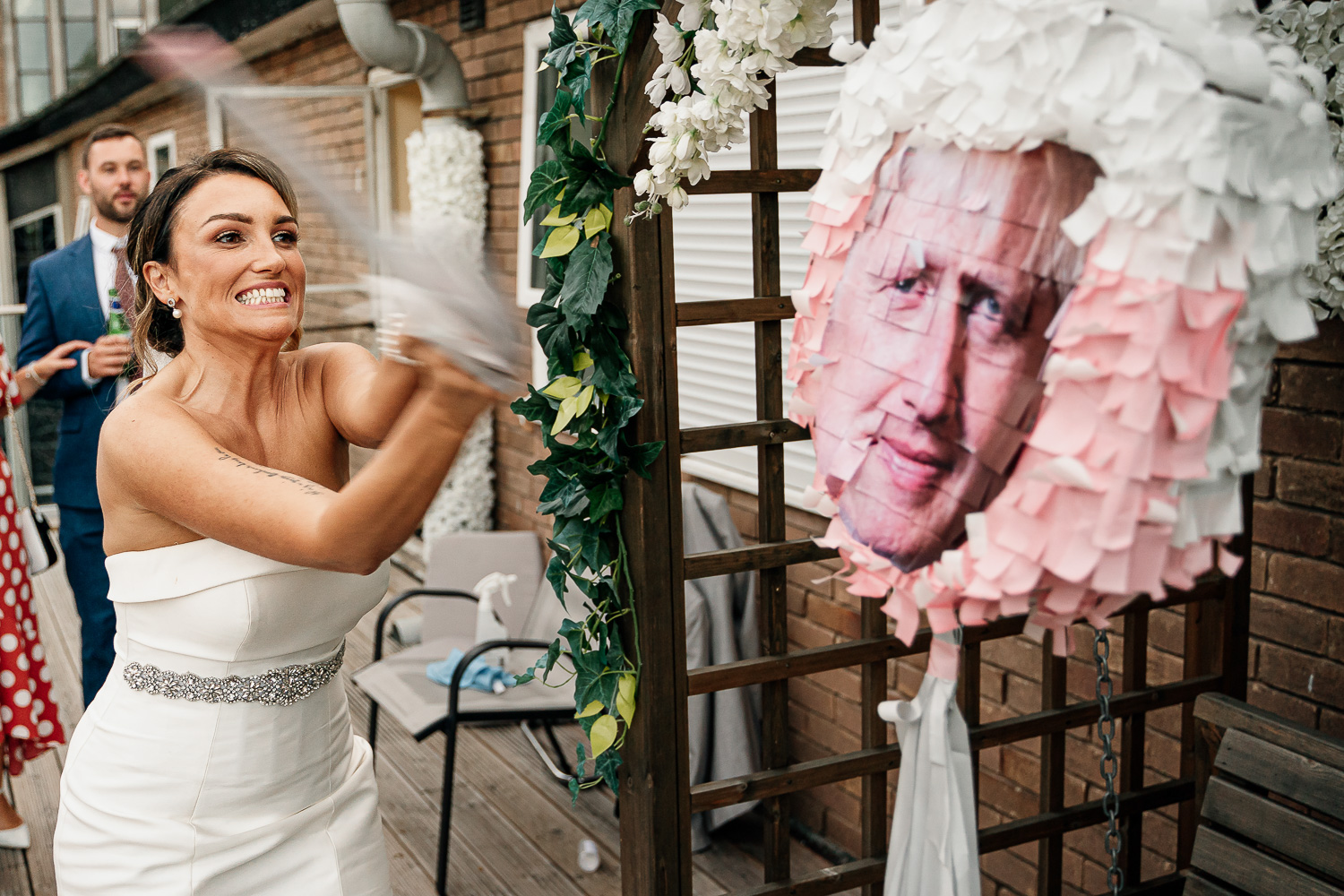 Bride hitting the Boris piñata