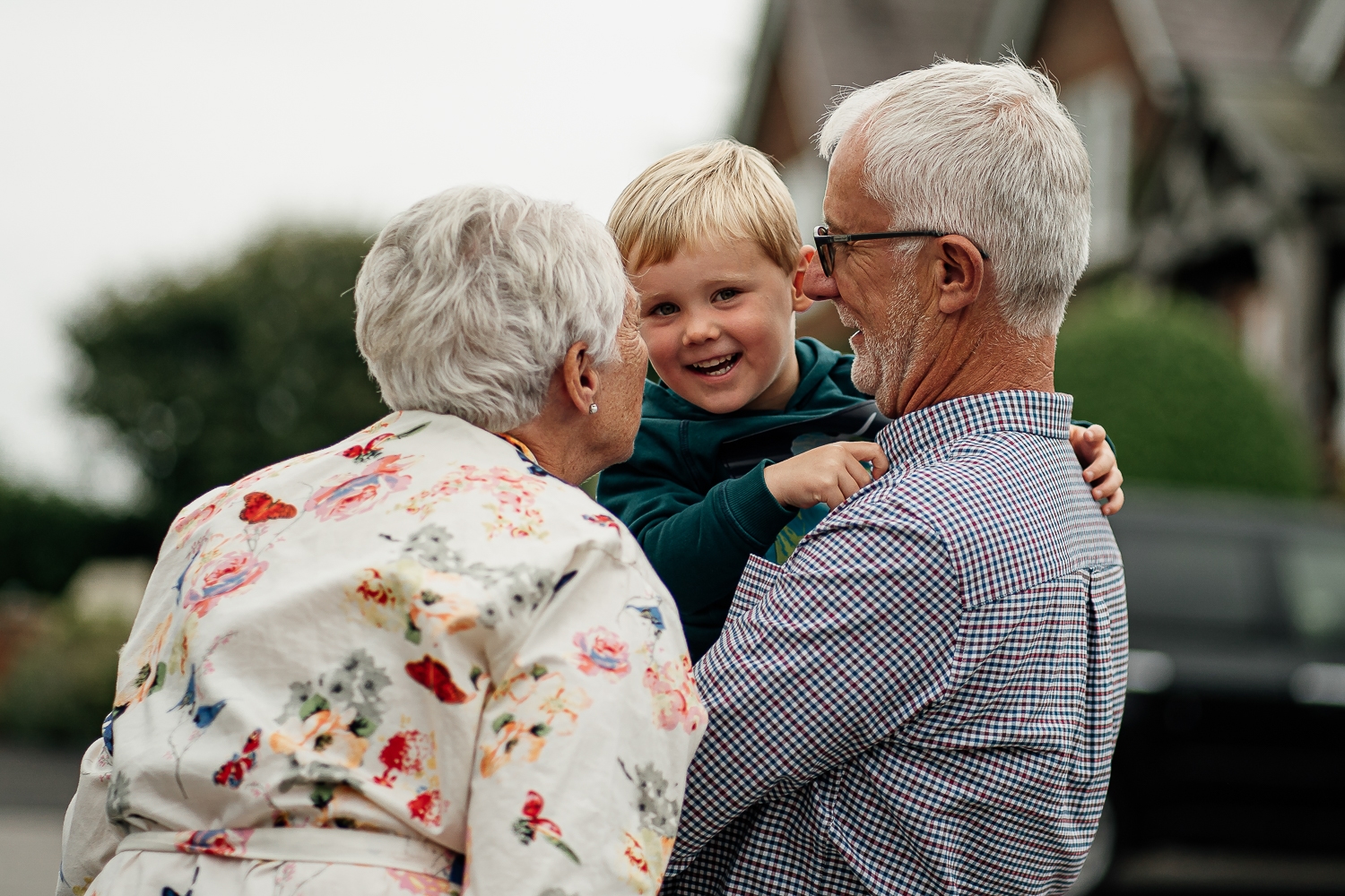 Grandparents playing with page boy