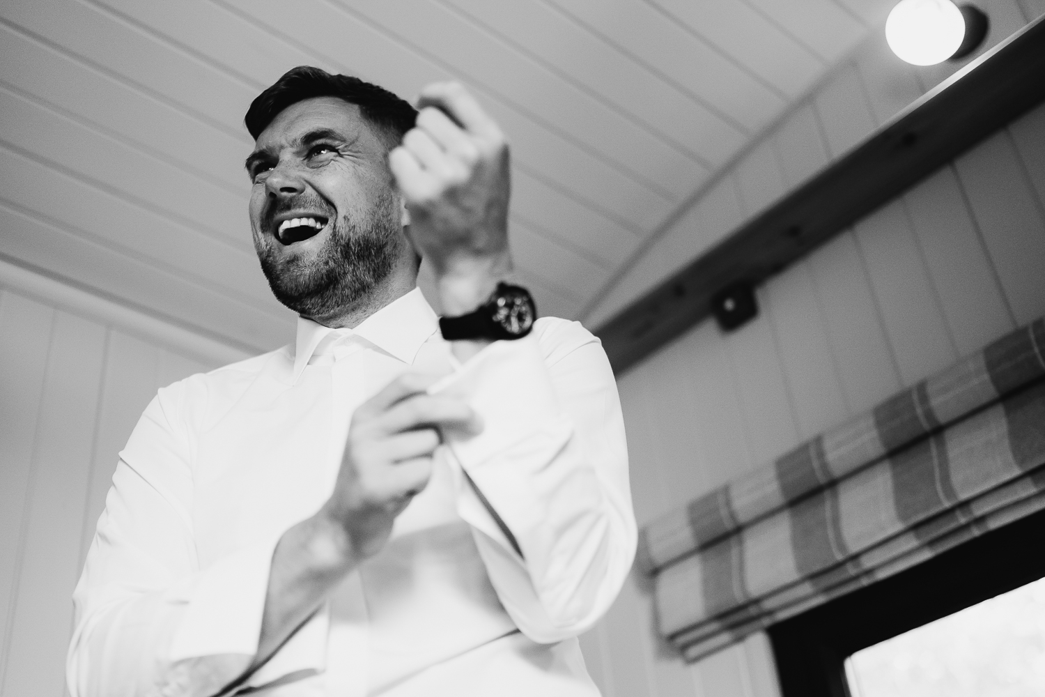 Groom getting dressed