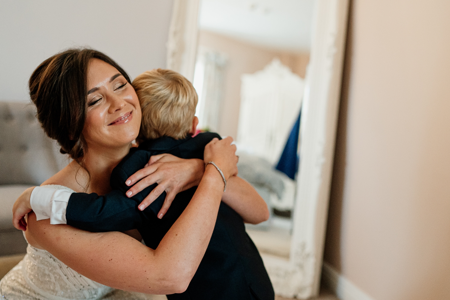 Bride hugging son