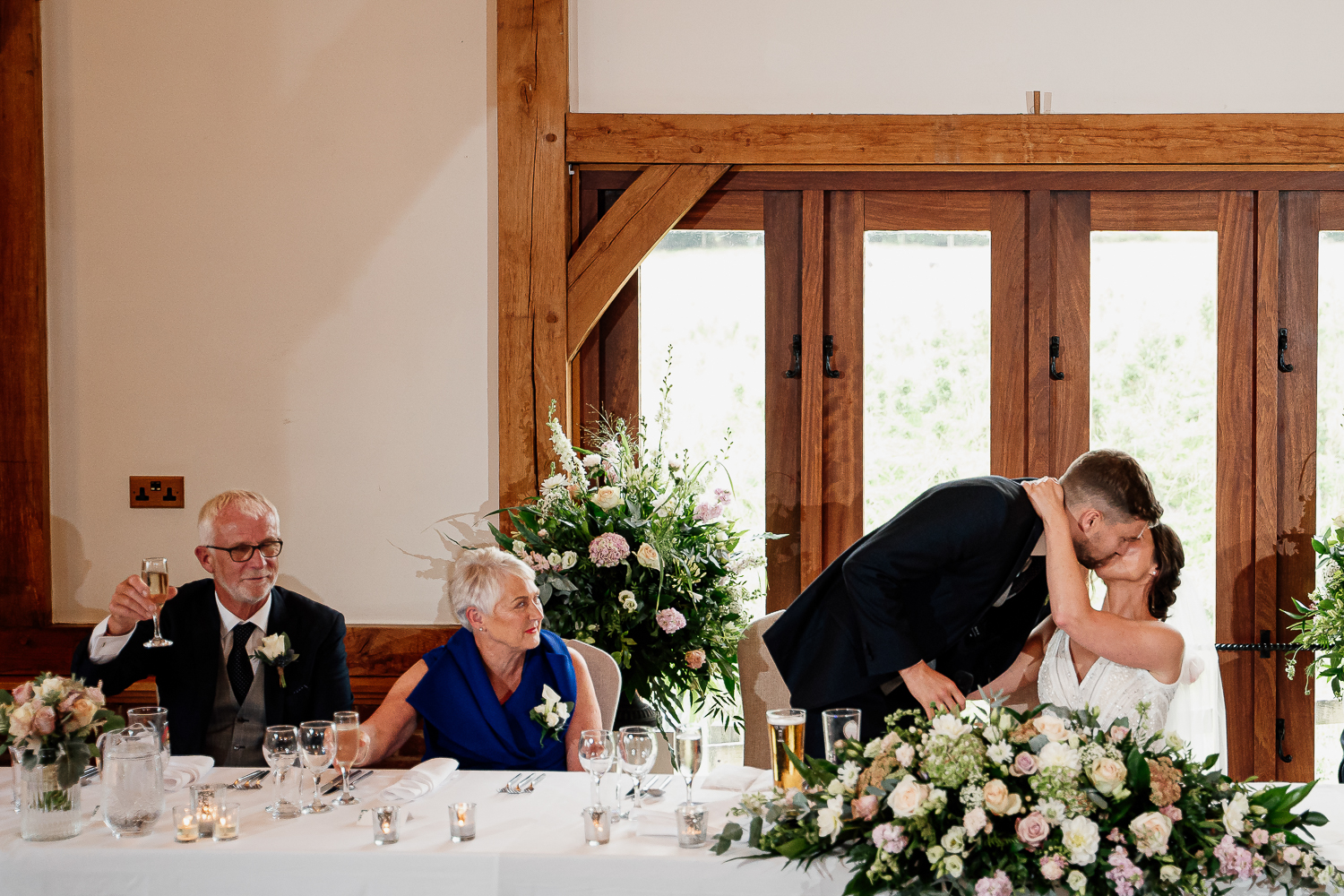 Groom kissing bride after speech